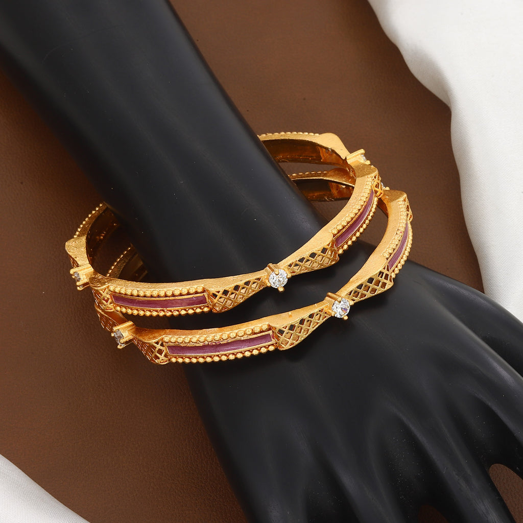 Traditional Gold Jaali Work Bangles with Pink Accents